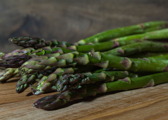 fresh asparagus on wooden table