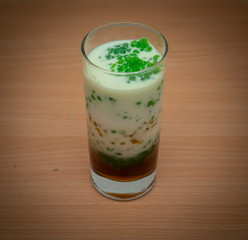 Ramadan food and drinks concept. Dates fruit in a bowl on wooden table background.