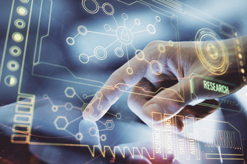 Multi exposure of man's hand holding and using a digital device and data theme drawing. Innovation...