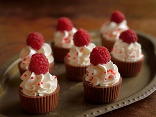 Cup of chocolate with apricot with wipped cream and raspberry