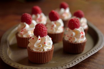 Cup of chocolate with apricot with wipped cream and raspberry