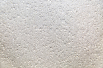 Background of insulation foam polystyrene white color with bumps, construction, texture, design.