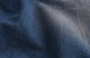 blue denim background with scuffed and creases