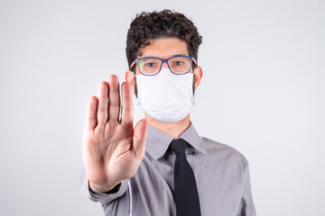 Businessman shows hand signal for the coronavirus epidemic pandemic originating in China. Virus Covid-19, SARS-CoV-2. Concept of social distance.