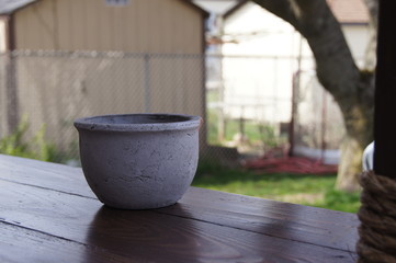 Naklejka premium This image depicts an empty ceramic vase, outside. 