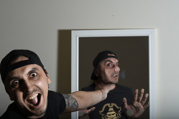 man choking himself in the mirror composite