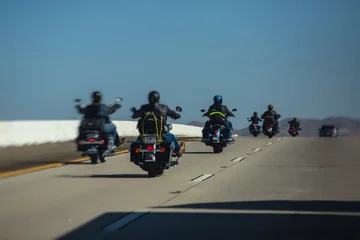 Foto op Aluminium Band of bikers riding on the interstate road, California, group of motorcycles on the Highway, on the way to Las Vegas from Los Angeles in San Bernardino city, California, United States, biker concept © tsuguliev