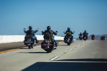 Band of bikers riding on the interstate road, California, group of motorcycles on the Highway, on...