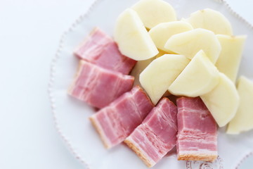 Chopped bacon and potato on dish for cooking ingredient