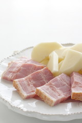 Chopped bacon and potato on dish for cooking ingredient