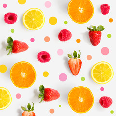 Pattern with strawberry, raspberry, lemon and orange. Tropical abstract background. Strawberry, raspberry, lemon and orange on the light background with pink dots.