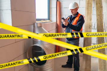 Construction stop due to quarantine. Repair process was stopped due to mass diseases. Inscription...