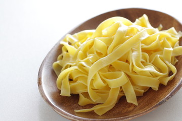 Italian food, prepared fettuccine flat pasta on plate