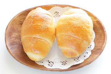 Homemade butter roll bread on wooden plate