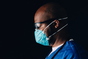 Moody portrait of medical healthcare worker wearing n95 mask