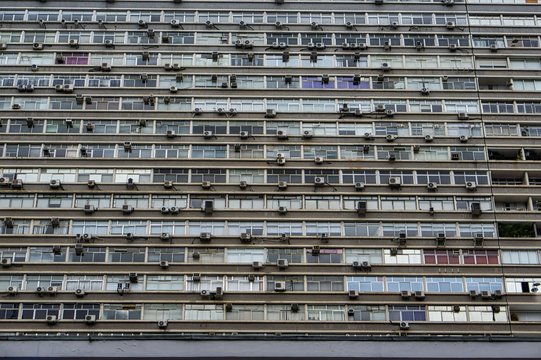 Close-up Front View Of A Run Down Grey Mass Apartment Block Building Close To The Famous Paulista Street In Sao Paulo, Brazil.