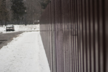 Brown metal fence.