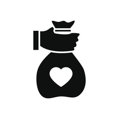 humanitarian aid concept, hand holding a charity bag icon, silhouette style