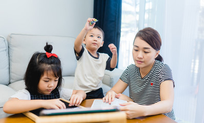 Covid-19 Coronavirus and Learning from home, Home school kid concept.Little asian girl study with...