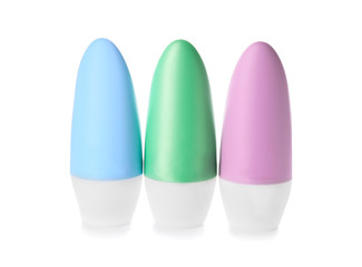 Different deodorants on white background