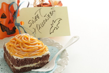 Halloween confectionery, pumpkin paste and chocolate cake