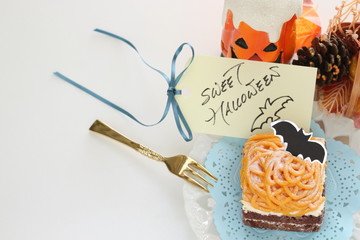 Halloween confectionery, pumpkin paste and chocolate cake
