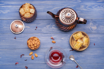 Fototapeta na wymiar Tasty Turkish tea with sweets on table