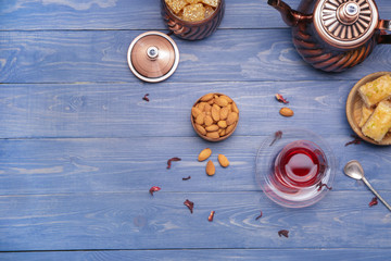 Tasty Turkish tea with sweets on table