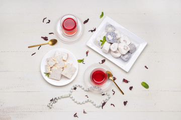 Fototapeta na wymiar Tasty Turkish tea with sweets on table