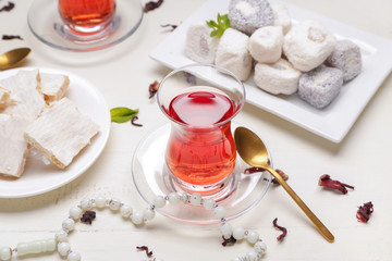 Tasty Turkish tea with sweets on table