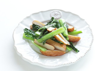 Asian food, fish cake and green leaf vegetable stir fried