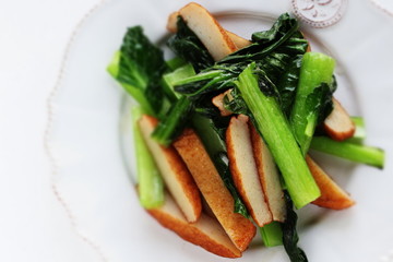 Asian food, fish cake and green leaf vegetable stir fried