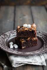 Chocolate brownie cake with marshmallows and nuts