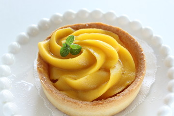 Homemade pumpkin tart with mint