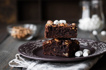 Chocolate brownie cake with marshmallows and nuts