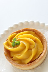Homemade pumpkin tart with mint