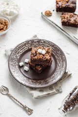 Chocolate brownie cake with marshmallows and nuts