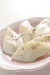 Prepared flat fish and pepper on dish for cooking ingredient
