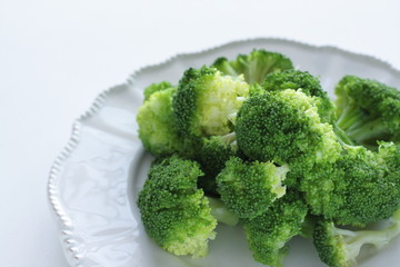 Boiled broccoli on dish with copy space