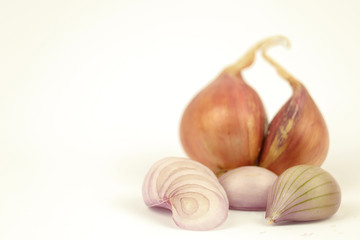 Fresh shallots or onions with green chilli isolated on white background