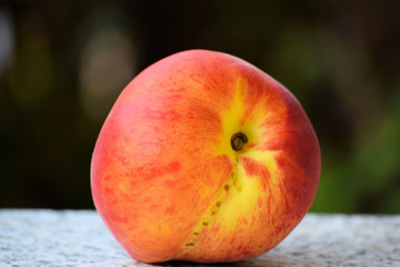 peach fruit . Side view on one red and yellow peach