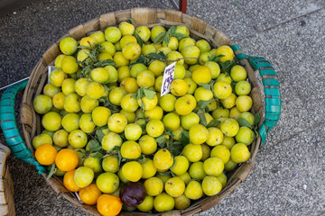 Green plum in basket Fair