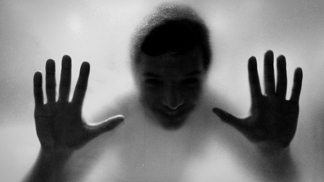 Person Seen Through Frosted Glass