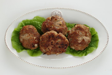 Homemade patty burger on dish with lettuce