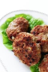 Homemade patty burger on dish with lettuce