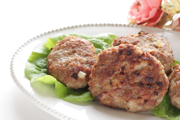 Homemade patty burger on dish with lettuce