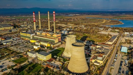 Wide angle shot of the nuclear plants of a city next to other facilities