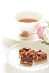 Mixed nuts and cookie on plate with copy space