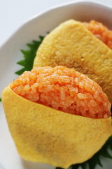 Japanese food, ketchup and wrapped egg rice ball