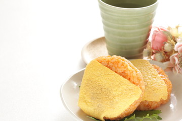 Japanese food, ketchup and wrapped egg rice ball